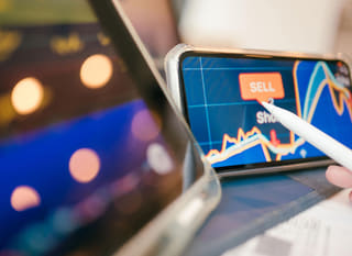 Investor reviewing forex options alongside Bitcoin and Ethereum across multiple markets